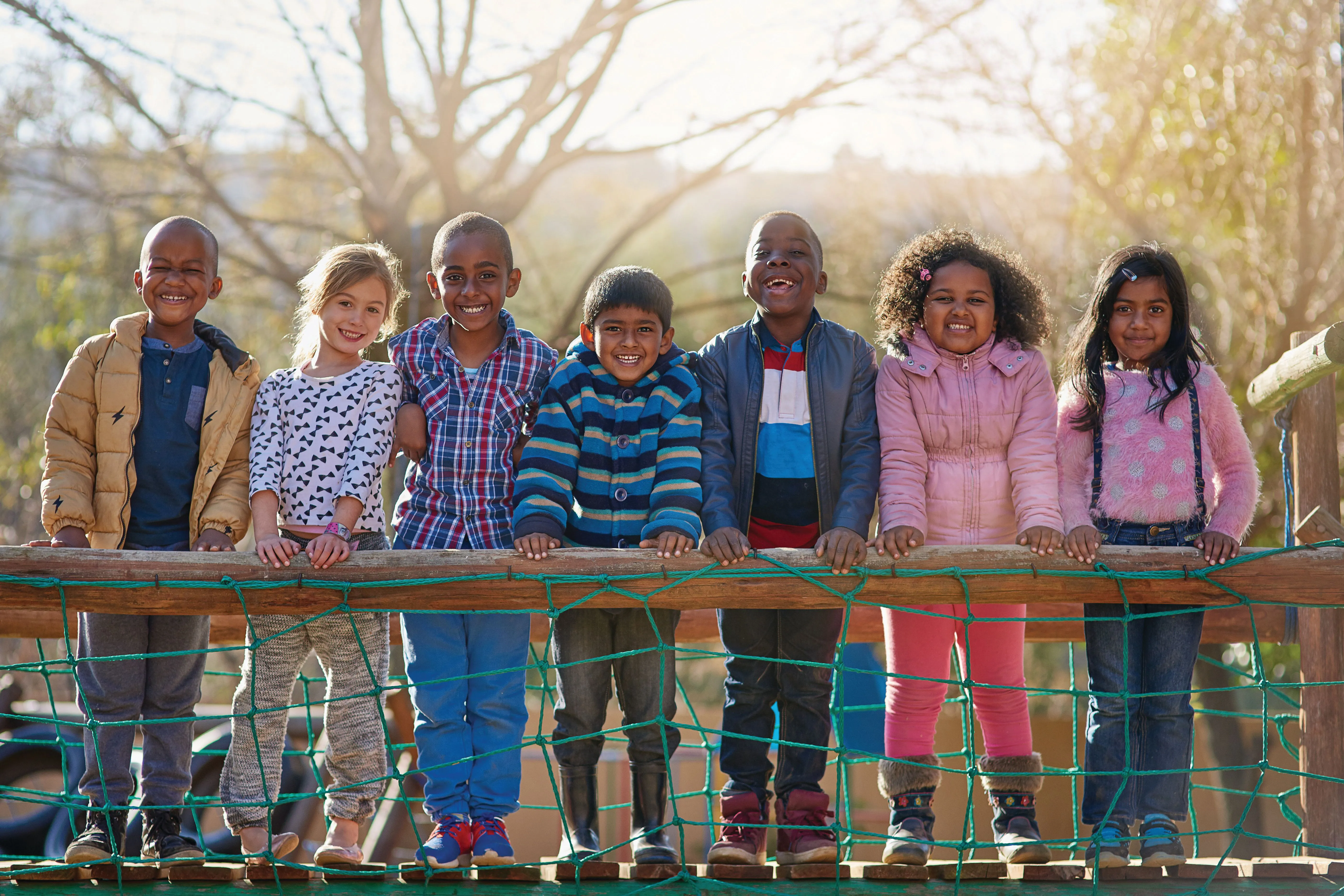 Happy children standing together on the playground